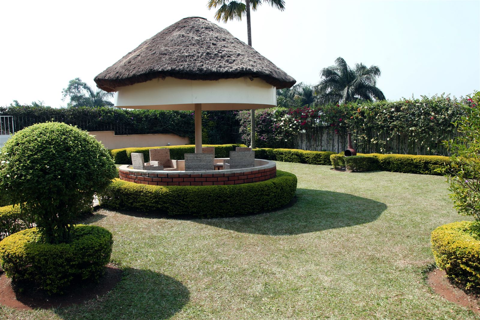 Thatched garden gazebo at Palm Gardens, Airport View Hotel Entebbe